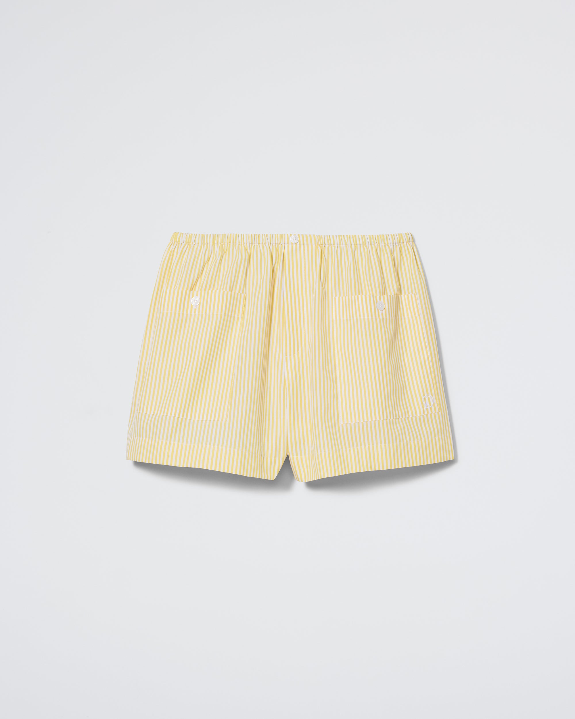 The Daphne "Shut Eye Boxer - Sun Stripe" features yellow and white vertical stripes, an elastic waistband, and two small white front buttons, shown on a plain white background.